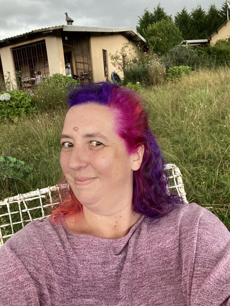 Bianca Johnson smiling in her garden